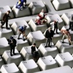 GERMANY - APRIL 05: GERMANY, Bonn, "Online" - Human miniatures on a computer keyboard. (Photo by Ulrich Baumgarten via Getty Images)