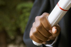 Graduate holding diploma