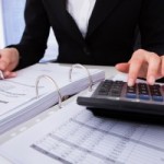 Businesswoman Calculating Tax