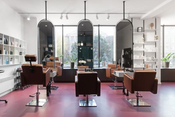 Chairs and mirrors in modern hairdressing, beauty salon